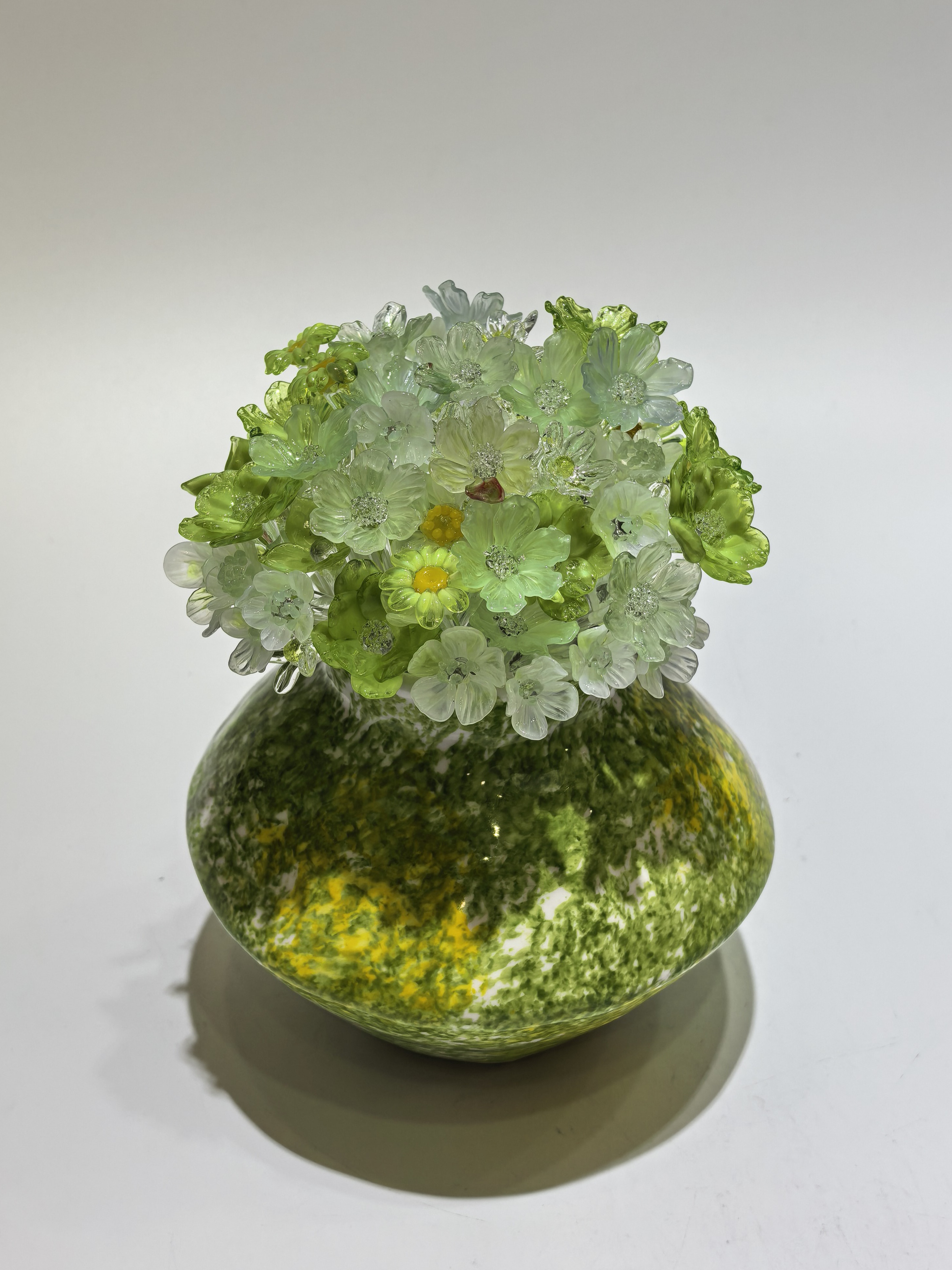 Green handmade glass flower arrangement from the SONG catalogue
